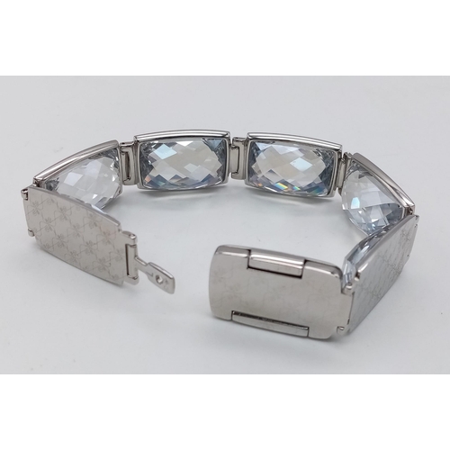 415 - A Stunning Swarovski Rhodium Plated ‘Nirvana-model 1166714’ Crystal
Bracelet. 19.5cm Length, 1.8cm W... 