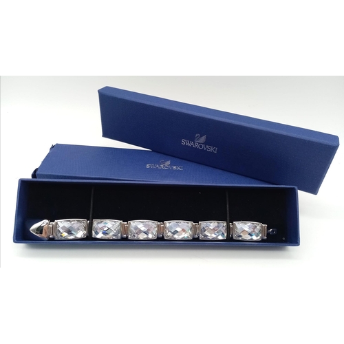 415 - A Stunning Swarovski Rhodium Plated ‘Nirvana-model 1166714’ Crystal
Bracelet. 19.5cm Length, 1.8cm W... 