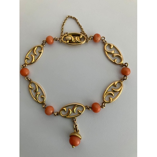 70 - Beautiful 10 carat GOLD BRACELET Having oval scroll links and set with CORAL detail. Complete with G... 