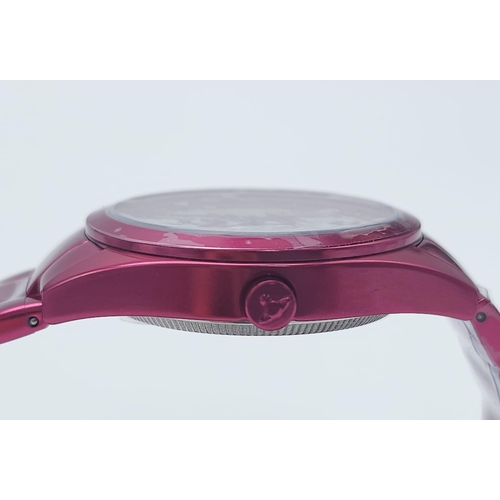 745 - A Vivienne Westwood Shocking Pink Ceramic 'Let it Rock' Quartz Watch. Ceramic bracelet and case - 35... 