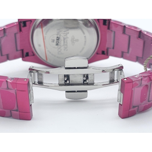 745 - A Vivienne Westwood Shocking Pink Ceramic 'Let it Rock' Quartz Watch. Ceramic bracelet and case - 35... 