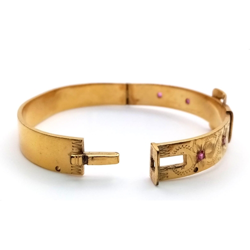 774 - A Vintage Fine Gold Hard Plated Ruby Set Buckle Design Hinge Bracelet.
6.3cm Inner width. Set with F... 