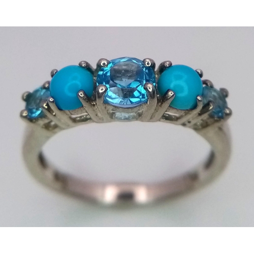 935 - A Sterling Silver Topaz & Turquoise Set Ring Size N. The Centre Topaz
measures 5mm Diameter. Rin... 