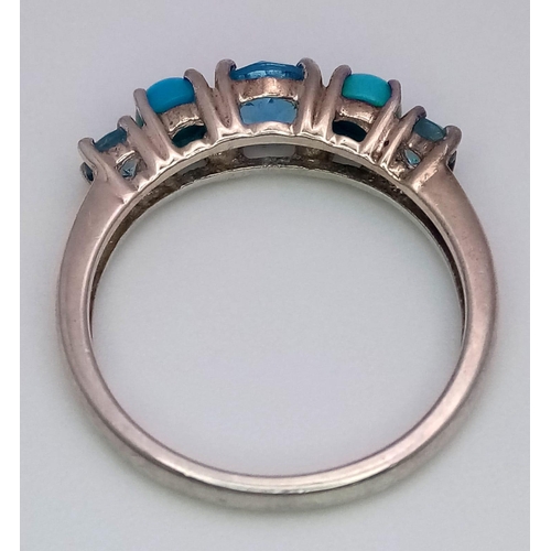 935 - A Sterling Silver Topaz & Turquoise Set Ring Size N. The Centre Topaz
measures 5mm Diameter. Rin... 