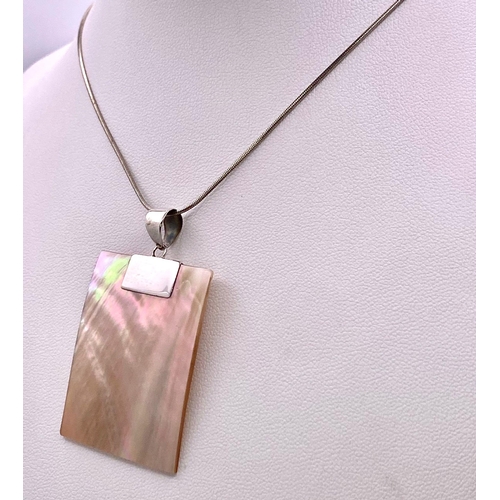 963 - An Unworn Contemporary Design Sterling Silver and Mother of Pearl
Necklace. 41cm Rope Chain. Pendant... 