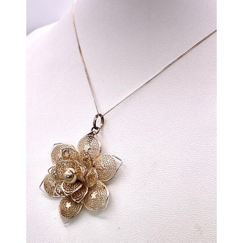 970 - A Sterling Silver Filigree Flower Design Pendant Necklace. 50cm Length
Chain. Pendant Measures 4cm D... 