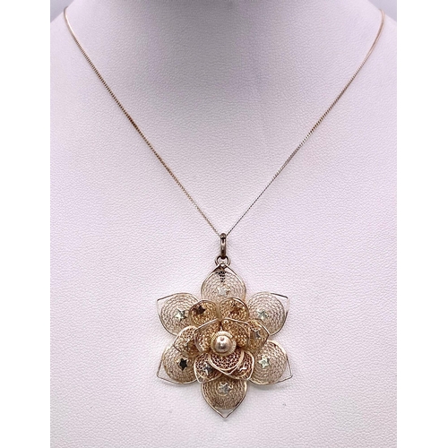 970 - A Sterling Silver Filigree Flower Design Pendant Necklace. 50cm Length
Chain. Pendant Measures 4cm D... 