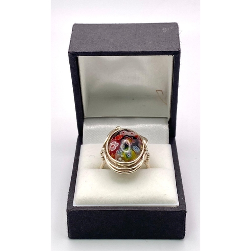 1010 - A Scarce, Vintage, Sterling Silver Milifiori Cabochon Ring Size R. The
Crown measures 2.5cm Length. ... 