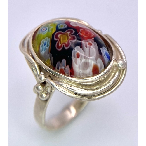 1010 - A Scarce, Vintage, Sterling Silver Milifiori Cabochon Ring Size R. The
Crown measures 2.5cm Length. ... 