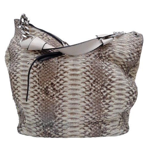 164 - A Classic Jimmy Choo Snakeskin Leather Hobo Bag.
With a unique double zip lock top and a twisted thi... 