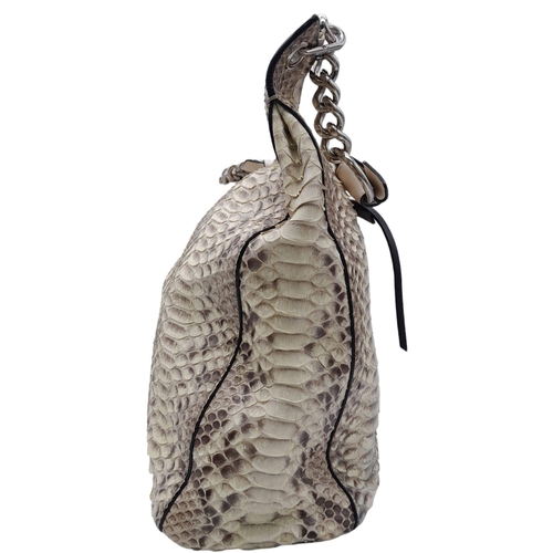 164 - A Classic Jimmy Choo Snakeskin Leather Hobo Bag.
With a unique double zip lock top and a twisted thi... 