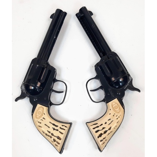 641 - A Now Rare Pair of Children’s Toy 1960’s Daisy Cap Guns with Leather
Holster and Dummy Bullets. In g... 