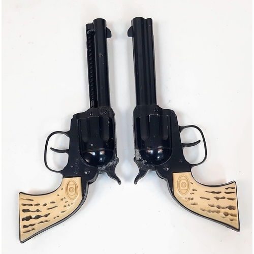 641 - A Now Rare Pair of Children’s Toy 1960’s Daisy Cap Guns with Leather
Holster and Dummy Bullets. In g... 