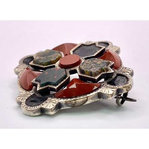 648 - A Rare Antique (Possibly Victorian) Celtic Hardstone Silver Brooch that can
also be worn as a Pendan... 