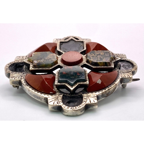 648 - A Rare Antique (Possibly Victorian) Celtic Hardstone Silver Brooch that can
also be worn as a Pendan... 