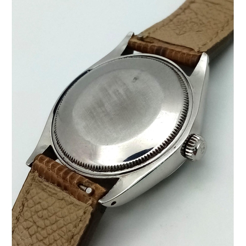 73 - A Vintage Rolex Air King Precision Gents Watch. Brown leather strap. Stainless steel case - 35mm. Si... 