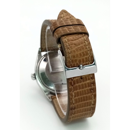 73 - A Vintage Rolex Air King Precision Gents Watch. Brown leather strap. Stainless steel case - 35mm. Si... 