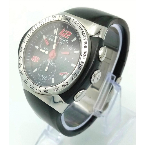 738 - A Tissot Nascar Quartz Gents Chronograph Watch. Original black rubber strap. Steel and rubber case -... 