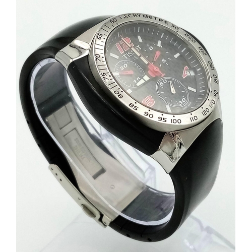 738 - A Tissot Nascar Quartz Gents Chronograph Watch. Original black rubber strap. Steel and rubber case -... 