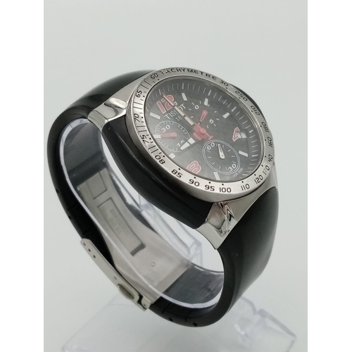 738 - A Tissot Nascar Quartz Gents Chronograph Watch. Original black rubber strap. Steel and rubber case -... 