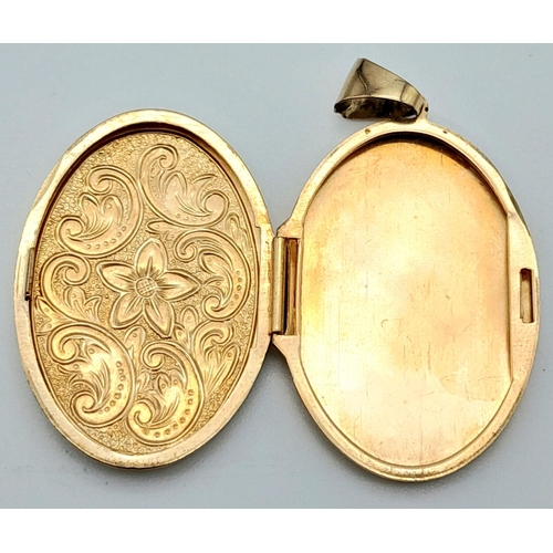 742 - 9k yellow gold engraved locket pendant, 4.3g (3.2cm x 2.3cm)