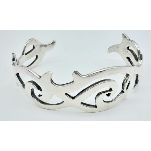 760 - An Unique Vintage Sterling Silver Celtic Design Bracelet. 6cm Inner width.
2.1cm Wide. Total Weight ... 