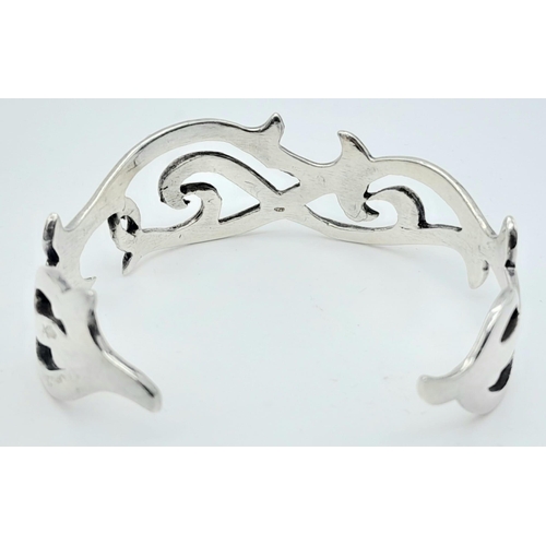 760 - An Unique Vintage Sterling Silver Celtic Design Bracelet. 6cm Inner width.
2.1cm Wide. Total Weight ... 