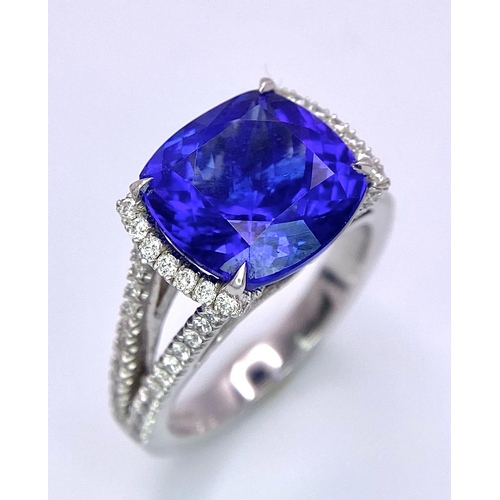 83 - A BESPOKE 18K WHITE GOLD TANZANITE & DIAMOND RING, SET WITH AAA QUALITY CUSHION CUT 6.17CT TANZANITE... 