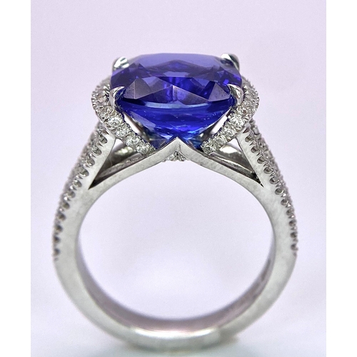 83 - A BESPOKE 18K WHITE GOLD TANZANITE & DIAMOND RING, SET WITH AAA QUALITY CUSHION CUT 6.17CT TANZANITE... 