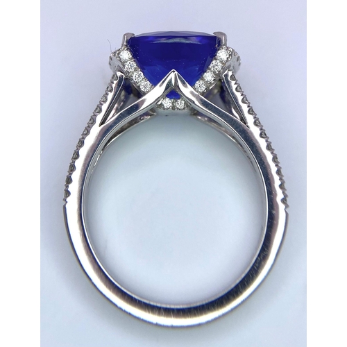 83 - A BESPOKE 18K WHITE GOLD TANZANITE & DIAMOND RING, SET WITH AAA QUALITY CUSHION CUT 6.17CT TANZANITE... 