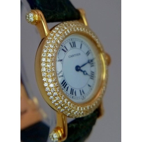 866 - An 18K Gold and Diamond Cartier Ladies Watch. Leather strap with Cartier gold clasp. Circular gold a... 