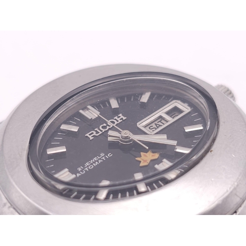 974 - A Vintage Ricoh Oval Cased 21 Jewel Automatic Gents Watch. Stainless steel bracelet and case - 39mm.... 