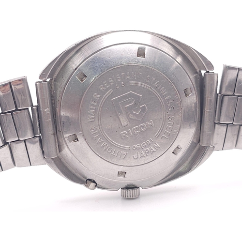 974 - A Vintage Ricoh Oval Cased 21 Jewel Automatic Gents Watch. Stainless steel bracelet and case - 39mm.... 