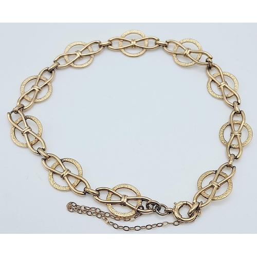 425 - 9k yellow gold openwork detailed bracelet with safety chain (19cm length), weight 6.6g