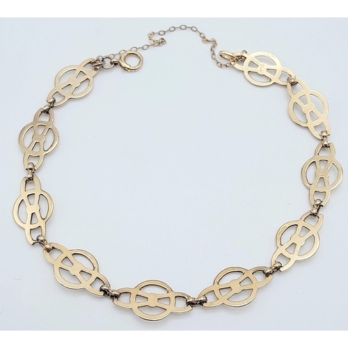 425 - 9k yellow gold openwork detailed bracelet with safety chain (19cm length), weight 6.6g