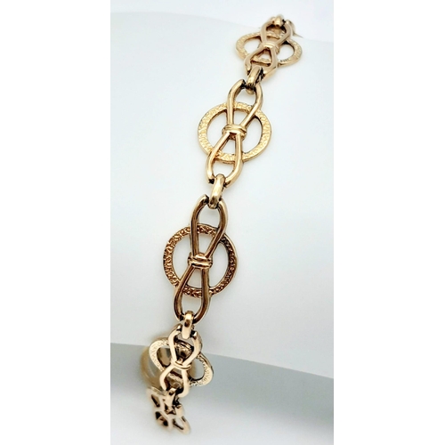 425 - 9k yellow gold openwork detailed bracelet with safety chain (19cm length), weight 6.6g