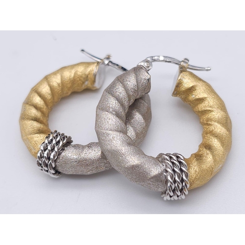 561 - Pair of 18k 2 colour gold twist hoops earrings, (2.8cm diameter) 8.1g