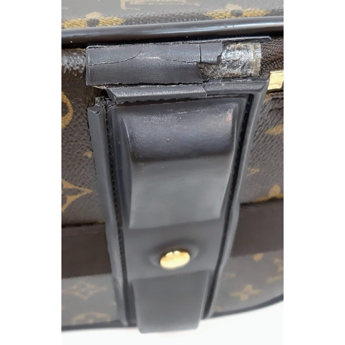 1321 - Louis Vuitton Suitcase in famed LV monogrammed pattern.
Comes with Dust Cover, Lock & Key and a LV s... 