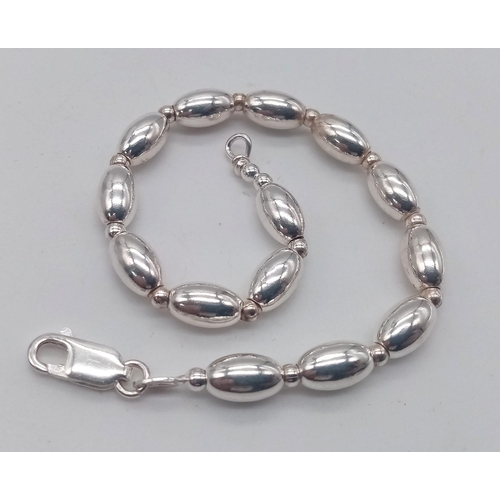 1201 - An Unworn Sterling Silver Oval Link Bracelet 20cm Length. Weight 13.63 Grams