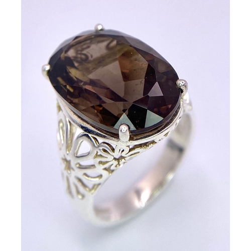 1335 - A fancy 925 silver faceted smoky Quartz solitaire ring mounted with floral designs base. Total weigh... 