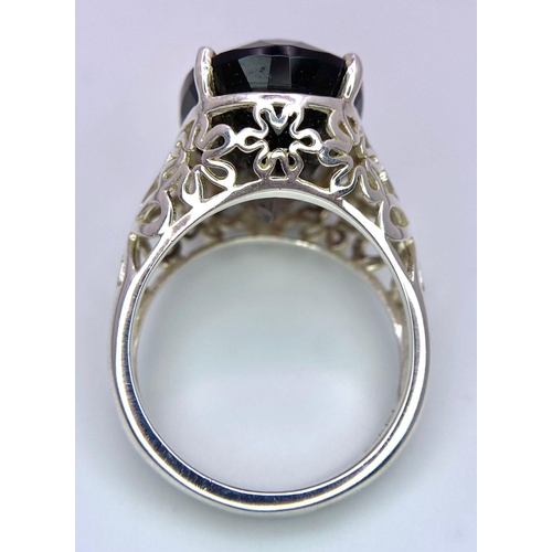 1335 - A fancy 925 silver faceted smoky Quartz solitaire ring mounted with floral designs base. Total weigh... 