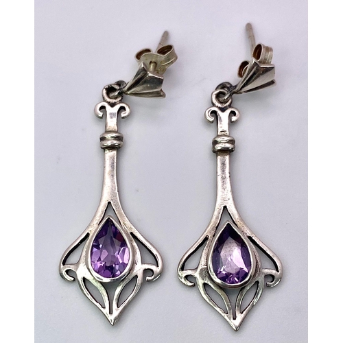 1398 - A matching set of fancy Amethyst jewellery include a pair of earrings & a solitaire ring (Size O). T... 