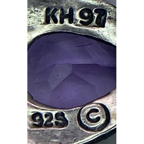 1398 - A matching set of fancy Amethyst jewellery include a pair of earrings & a solitaire ring (Size O). T... 