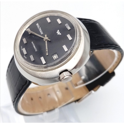 1432 - A Rare Vintage Waltham Automatic Gents Watch. Black leather strap. Stainless steel oval case - 40mm.... 