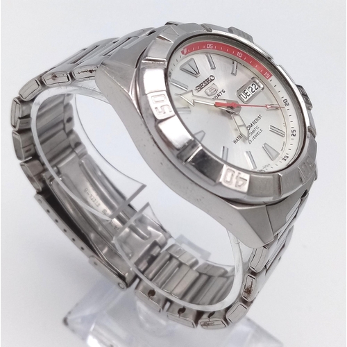 1494 - A Seiko 5 Sports Automatic Gents Watch. Stainless steel bracelet and case - 40mm. Silver tone dial w... 