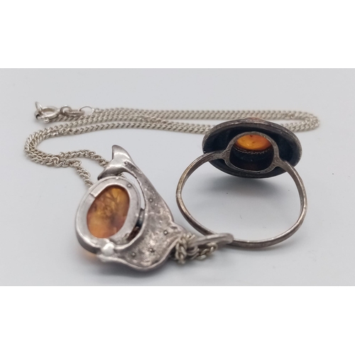 1601 - A matching set of 925 silver Amber jewellery include a solitaire ring with size N & a Dolphin 