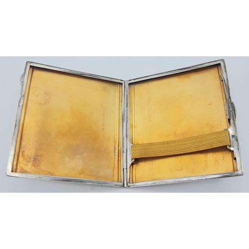 1682 - A Vintage Sterling Silver Cigarette Case. Machine tooled exterior decoration with a rich gilded inte... 