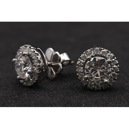 232 - PAIR OF 18K WHITE GOLD DIAMOND HALO STUD EARRINGS, WITH 1.20CT MAIN ROUND BRILIANT CUT STONES, AND F... 