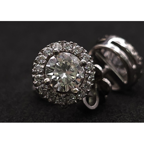 232 - PAIR OF 18K WHITE GOLD DIAMOND HALO STUD EARRINGS, WITH 1.20CT MAIN ROUND BRILIANT CUT STONES, AND F... 