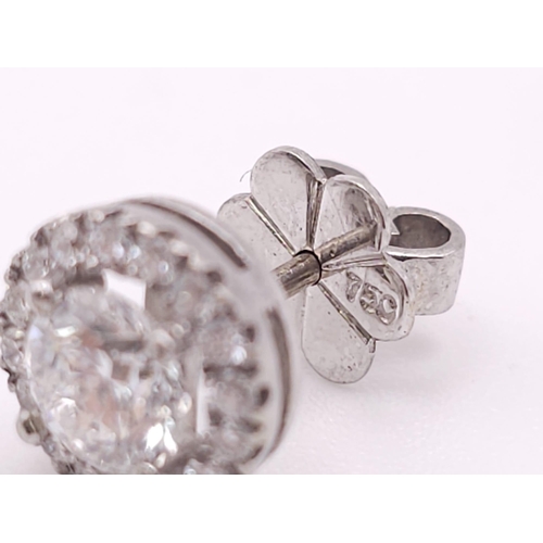 232 - PAIR OF 18K WHITE GOLD DIAMOND HALO STUD EARRINGS, WITH 1.20CT MAIN ROUND BRILIANT CUT STONES, AND F... 